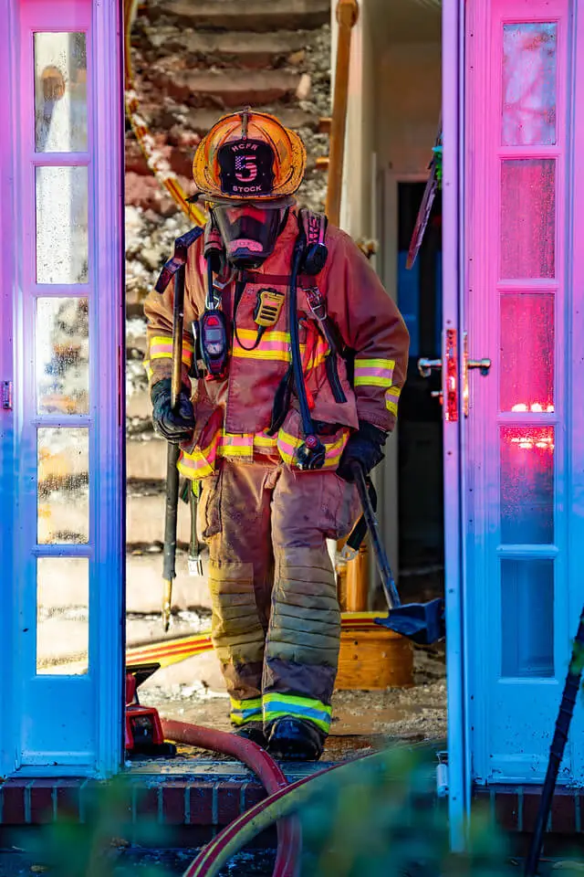 Responsive image of a firefighter walking out